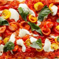 Bruschetta Rustica · Heirloom tomatoes, fresh mozzarella, fresh basil, and our authentic pizza sauce.