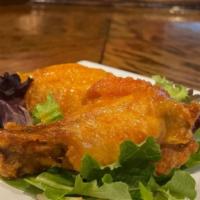 Fried Chicken Wings · Choice of house made buffalo (mild or hot), asian love sauce, spicy BBQ sauce, sweet BBQ sau...