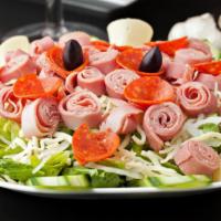 Antipasto Salad · Salami, ham, and pepperoni, tossed over crisp lettuce with tomatoes, black olives, cucumber,...