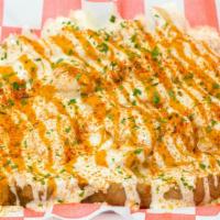 Loaded Buffalo Chicken Potato · Spud loaded with buffalo chicken and cheese.