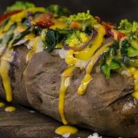 Veggie Spud · Potato loaded with bell peppers, onion, mushrooms and cheese!.