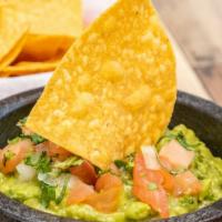 Guacamole · Fresh avocados, diced onions, diced tomatoes, chopped cilantro and lime juice all mixed for ...