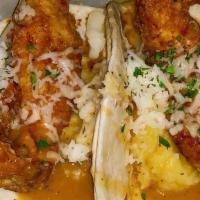 Fried Chicken Tacos · Two soft shell tacos with crispy chicken, garlic mashed potatoes, white cheddar, pepper gravy.