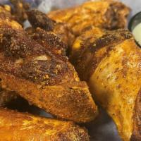 Chicken Wings · Six wings tossed in your choice of coaches signature sauce. Served with ranch, blue cheese, ...