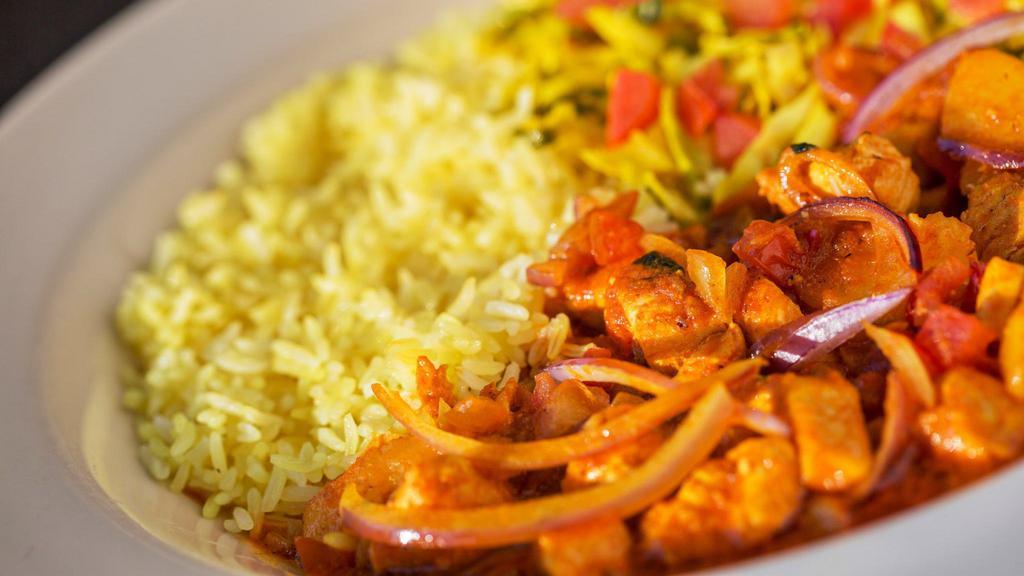 Chicken Curry · Tender pieces of boneless chicken breast and potatoes, sauteed in onions, tomatoes, curry, and ginger.