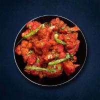 Cauli Martial · Cauliflower flowerets, seasoned, batter-fried, and sauteed with green onions and Indo-Chines...