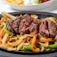 Sizzlin' Fajitas · Plentiful portion of marinated grilled chicken, steak, or shrimp, served with grilled pepper...