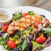 Grilled Salmon Salad · Mixed greens with cherry tomato, mushrooms, red onions, and corn topped with grilled salmon ...