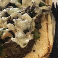 Philly Steak · Onions, mushrooms, green peppers & mozzarella  cheese