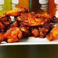 Medium Wings · 10 pieces jumbo chicken wings get them naked or sauced with one of our signature sauces.