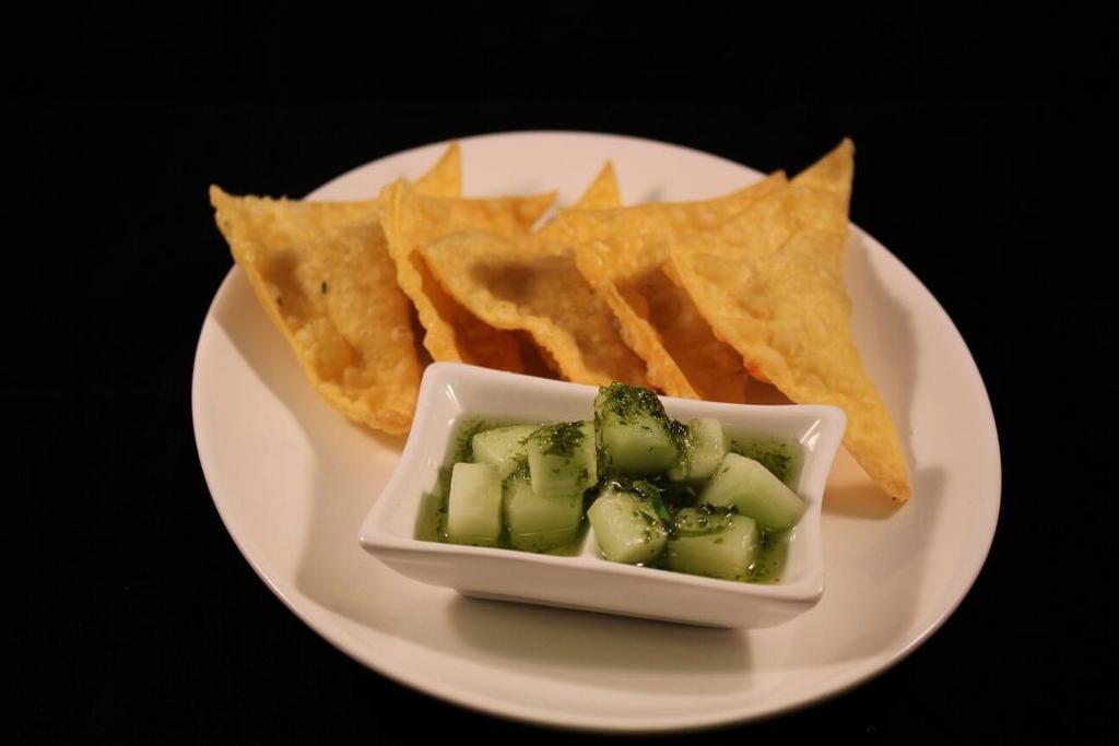 Curry Puffs · Curry flavored chicken, potato and onion fried in a wonton wrapper and served with a fresh cucumber sauce.