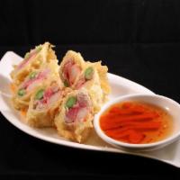 Simply Roll · Sushi grade tuna, imitation crab and asparagus, rolled with an egg roll wrapper, tempura bat...