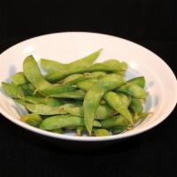 Edamame Pods · Steamed soybean pods dusted with salt.