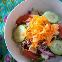 Grilled Chicken Salad · Marinated, diced chicken breast, shredded green and red cabbage, cucumbers, cilantro, red on...
