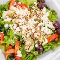 Greek Salad · Green salad with Feta cheese and black olives.