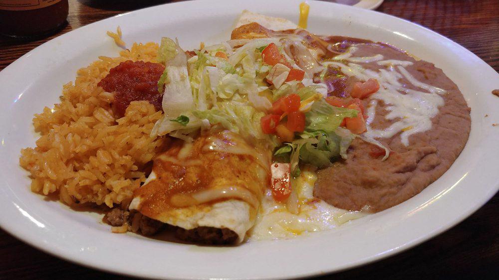 #14 One Beef Burrito Tipico · with rice & refried beans.