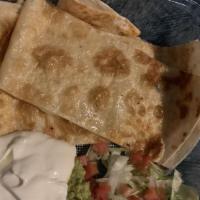 Spinach Quesadilla · Large toasted flour tortillas filled with a blend of melted cheese. served with sour cream a...