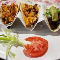 Three Beef Tacos (Soft) · Tacos filled with ground beef, lettuce, tomatoes, and a blend of cheeses.