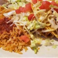 Three Chicken Tacos (Soft) · Tacos filled with chicken, lettuce, tomatoes, and a blend of cheeses.