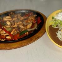 Special #2 Chicken Fajita · Lunch portion of grilled chicken, peppers, onions served with rice and beans and salad.