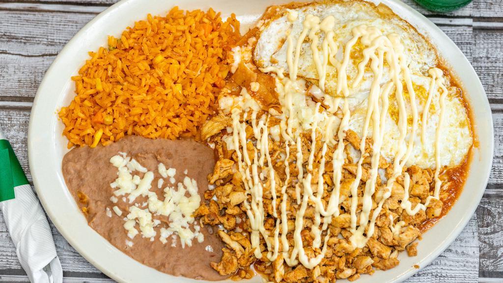 Chilaquiles Con Huevo · Tortilla strips sautéed with green or red sauce. Top with melted cheese & sour cream, chicken, beef, pastor or chorizo..