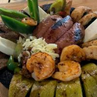 Molcajete · Grilled chicken, carne asada, chorizo, shrimps, cheese, onions, nopales(cactus), bell pepper...
