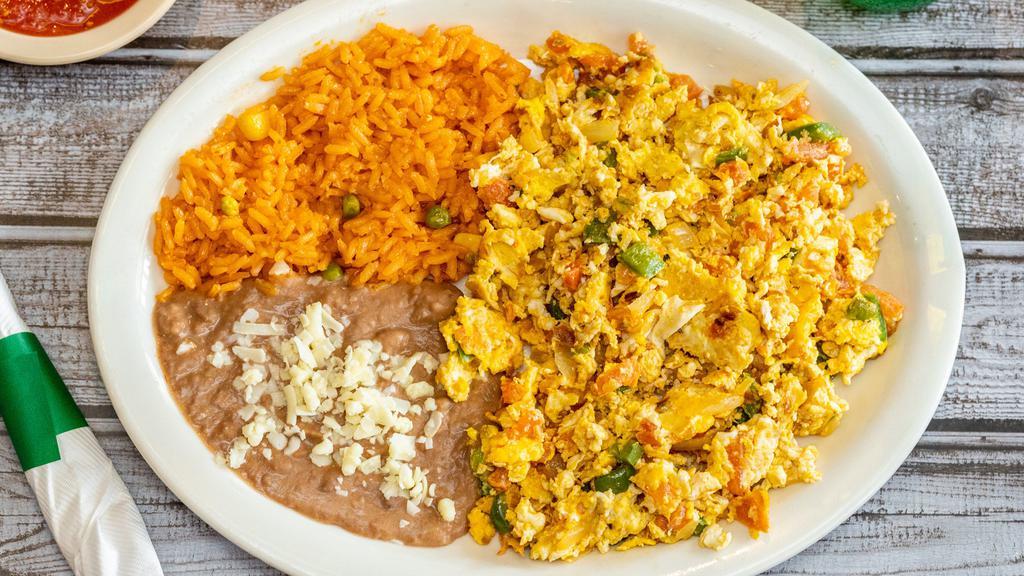 Huevos A La Mexicana · Scrambled eggs, mixed with bell peppers, onions, tomato & jalapeño.