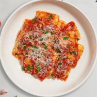 Ravioli With Marinara · Fresh ravioli cooked with our house made marinara sauce, mozzarella cheese, and topped with ...