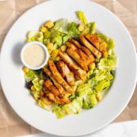 Classic Chicken Caesar Salad · Crisp romaine lettuce, parmesan cheese and crunchy croutons. Served with caesar dressing on ...