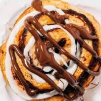 Nutella Cinnamon Roll · A large, gourmet cinnamon roll made with moist buttery dough and packed with rich, imported ...