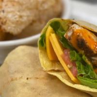 Grilled Buffalo Chicken Wrap · Grilled Chicken Breast Tossed in Buffalo Sauce, Lettuce, Tomato, Cheddar Cheese & Ranch.
