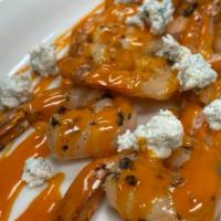 Grilled Buffalo Shrimp · Grilled Shrimp Tossed in Buffalo Sauce, Blue Cheese & Ranch.
