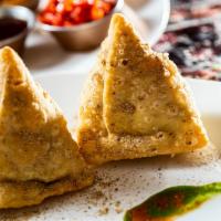 Vegetables Samosa (2 Pieces) · Turnover stuffed with peas and potato.