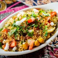 Dahi Papri Chat · Lentil crisps, chickpeas, and potatoes layered with different chutneys, yogurt, and chat mas...