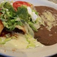 Chimichanga · One flour tortilla, soft or fried, filled with chicken or beef tips, topped with nacho chees...