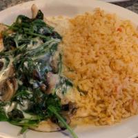 Pollo Tapatio · Grilled chicken breast covered with fresh sliced mushrooms, spinach, and onions. Smothered w...
