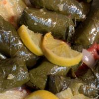 Grape Leaves · Vegan. Stuffed with rice, onion, tomatoes, and parsley.