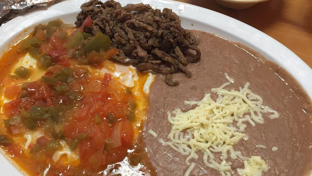 Huevos Rancheros · Served with rice, beans, and tortillas.