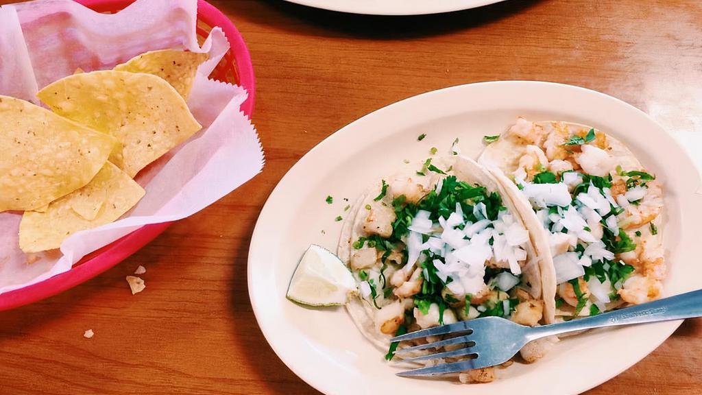 Taco Shrimp (Camaron) · Served on two soft corn tortillas. Topped with onions and cilantro.