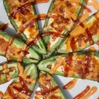 Fresh Jalapeno Poppers · Fresh jalapeno halves stued with cream cheese, cheddar & bacon w/ Southwest ranch & BBQ driz...
