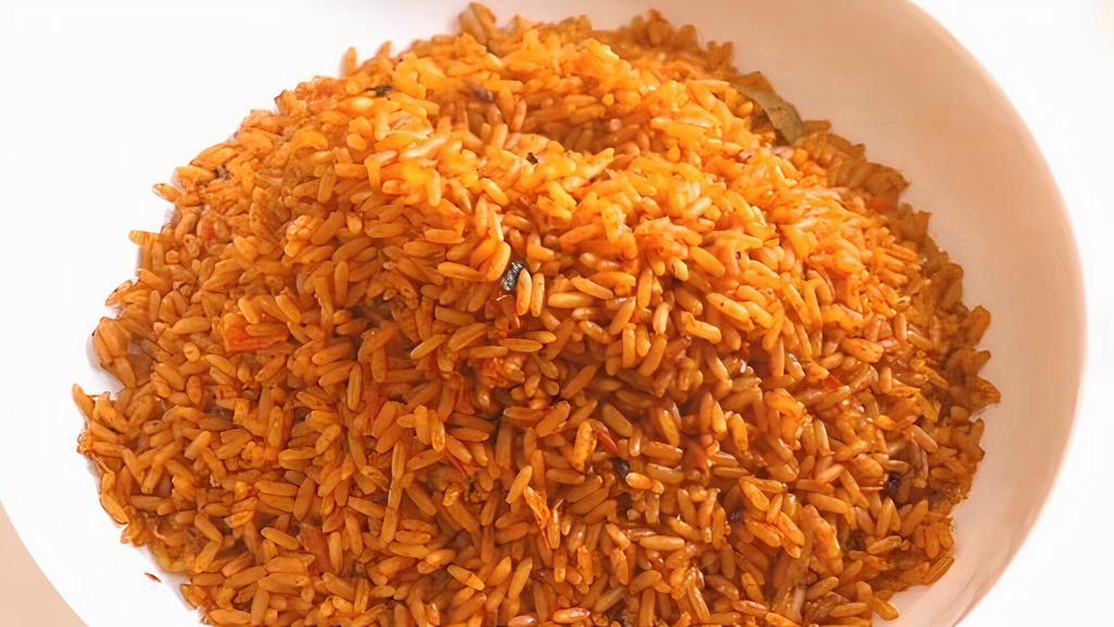 Jollof Rice With Grilled Chicken · Flavored rice cooked in blended tomatoes with spices and seasoning.