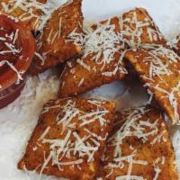 Fried Ravioli · Ravioli stuffed with a rich blend of ricotta, mozzarella, and parmesan cheeses fried to a go...