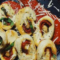 Pepperoni Knots · Our handmade dough all knotted up and stuffed with pepperoni and mozzarella. Served with a s...