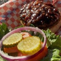 Bourbon Bacon Jam · Our Famous 1/2lb flame grilled burger topped with apple wood smoked bacon, covered with home...