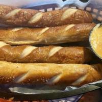 Pretzel Sticks · 4 jumbo soft baked pretzels with a side of beer cheese.