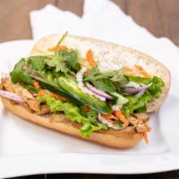 Vegan Vietnamese Sandwich · Tofu, vegan spread, mushroom pate, lettuce, pickled daikon+carrot, onion, cucumber, jalapeno...