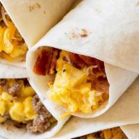 Breakfast Wrap · 3 scrambled eggs, VIP ham, cheddar cheese, and smoked bacon wrapped in a warm whole wheat to...