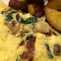 California Omelet · Served with a side of our oven-roasted potatoes. Fancy mushrooms, sun-dried tomatoes, artich...