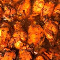 Buffalo Wings · Baked and served with parmesan peppercorn ranch and hot sauce