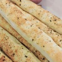 Breadsticks · Baked and served with marinara sauce.